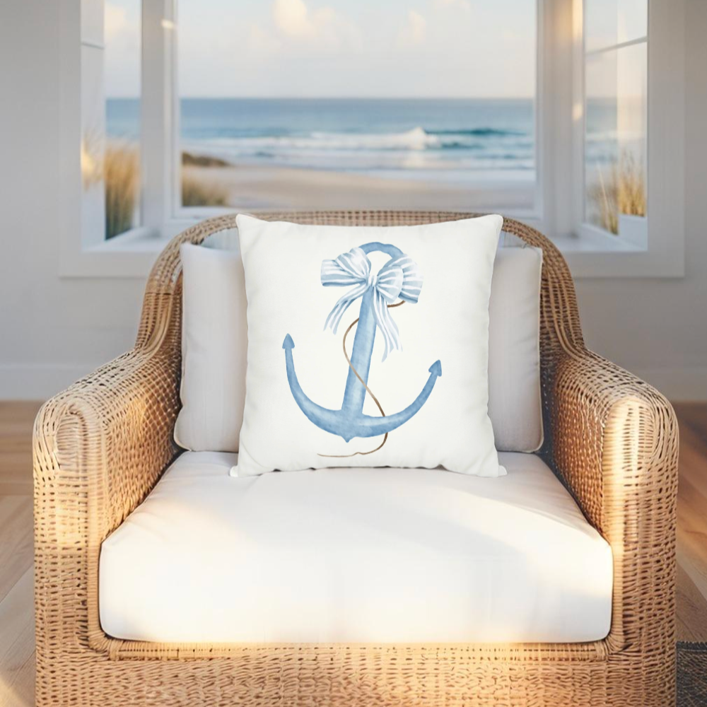 Coastal decorative pillow featuring an anchor design in blue and white tones.