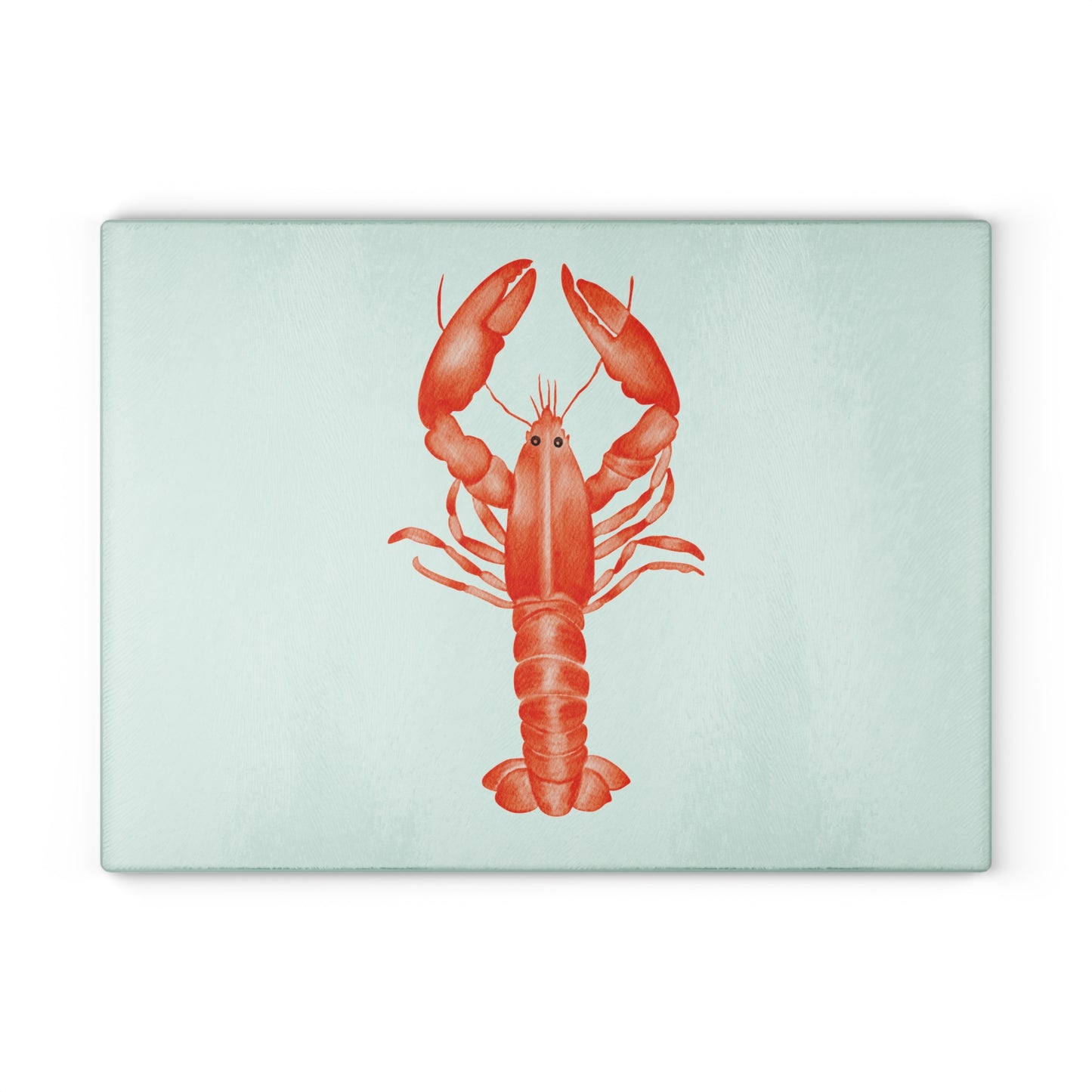 Coastal-style tempered glass cutting board with lobster artwork