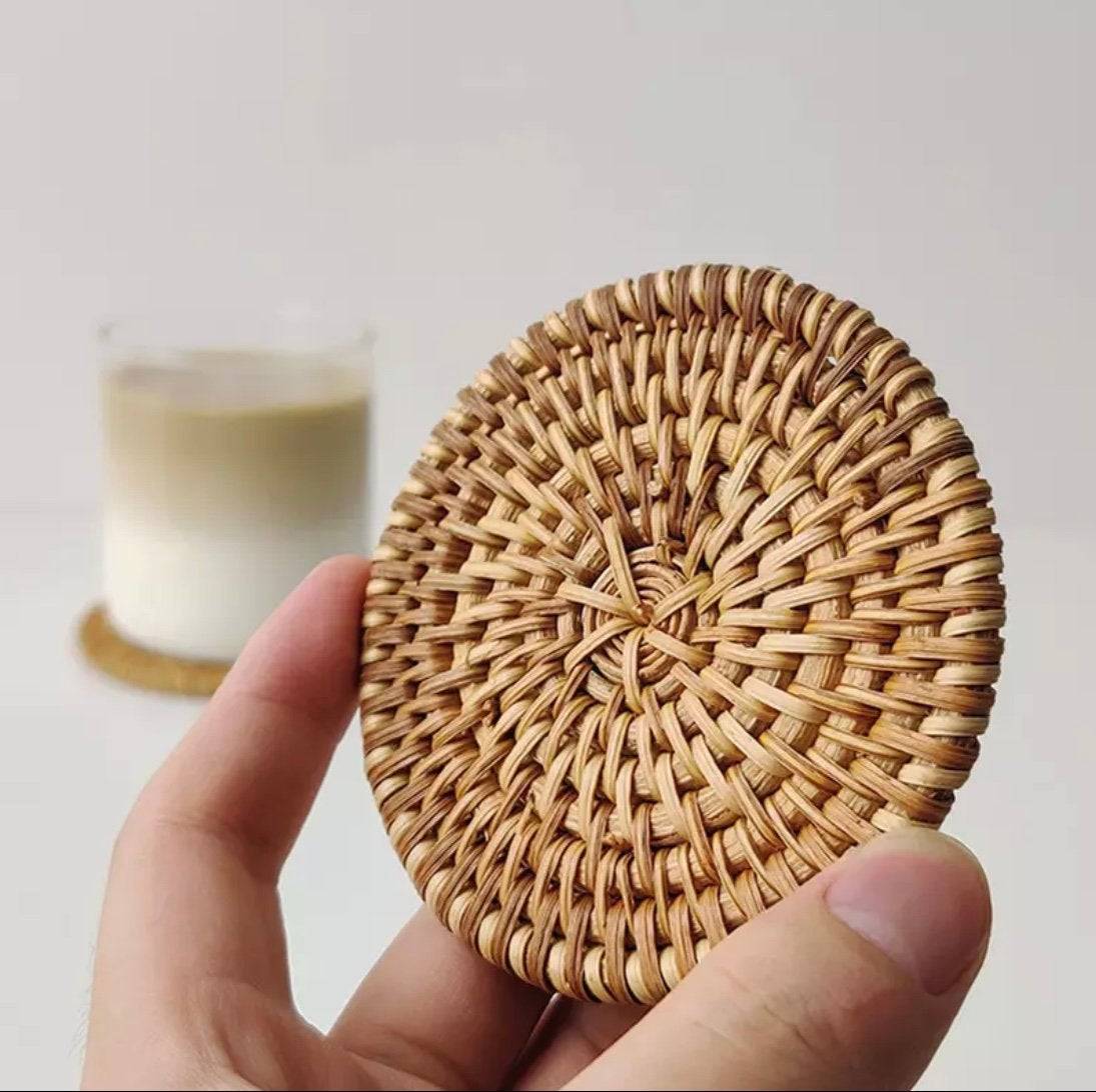 Natural coastal rattan coasters used in a home decor lifestyle photo