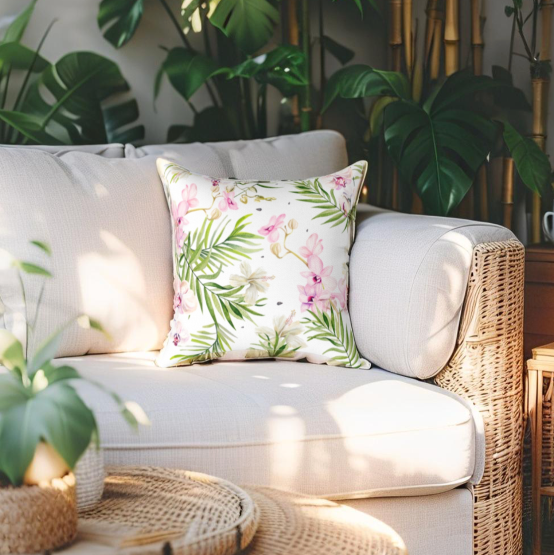 Palm leaf and floral pillow in green and pink for tropical decor themes.