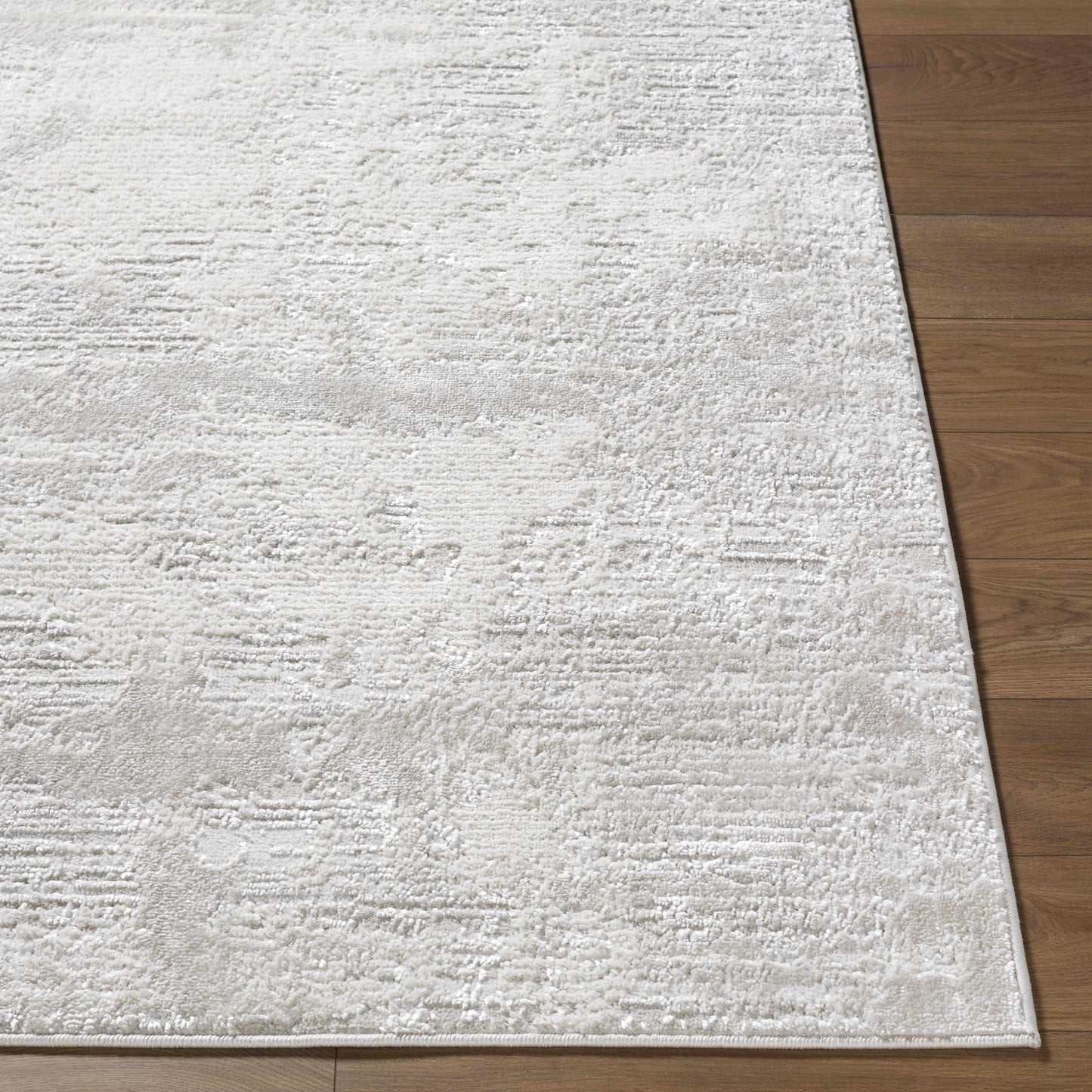 Soft textured coastal farmhouse rug with a neutral palette and medium pile for cozy interiors.