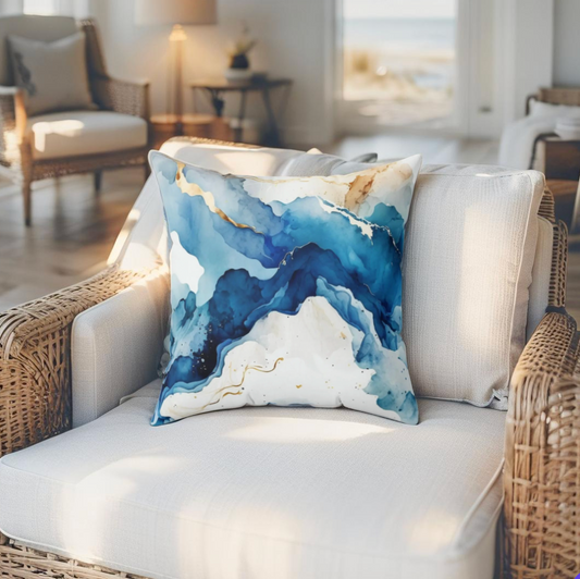 Decorative blue pillow featuring marble wave pattern, adds a bold nautical vibe to any space.