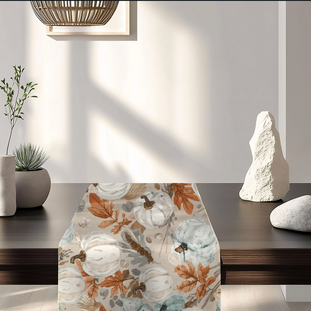 Elegant fall table runner with pumpkins and seashells for coastal-inspired autumn decorating.