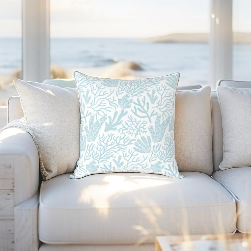 Reef-themed coastal pillow in light blue tones, adds a touch of marine, nautical, and coastal elegance to any room.
