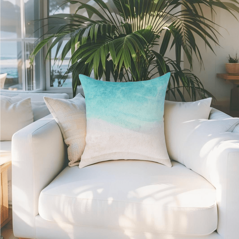 Blue and white ocean-themed throw pillow on a chair