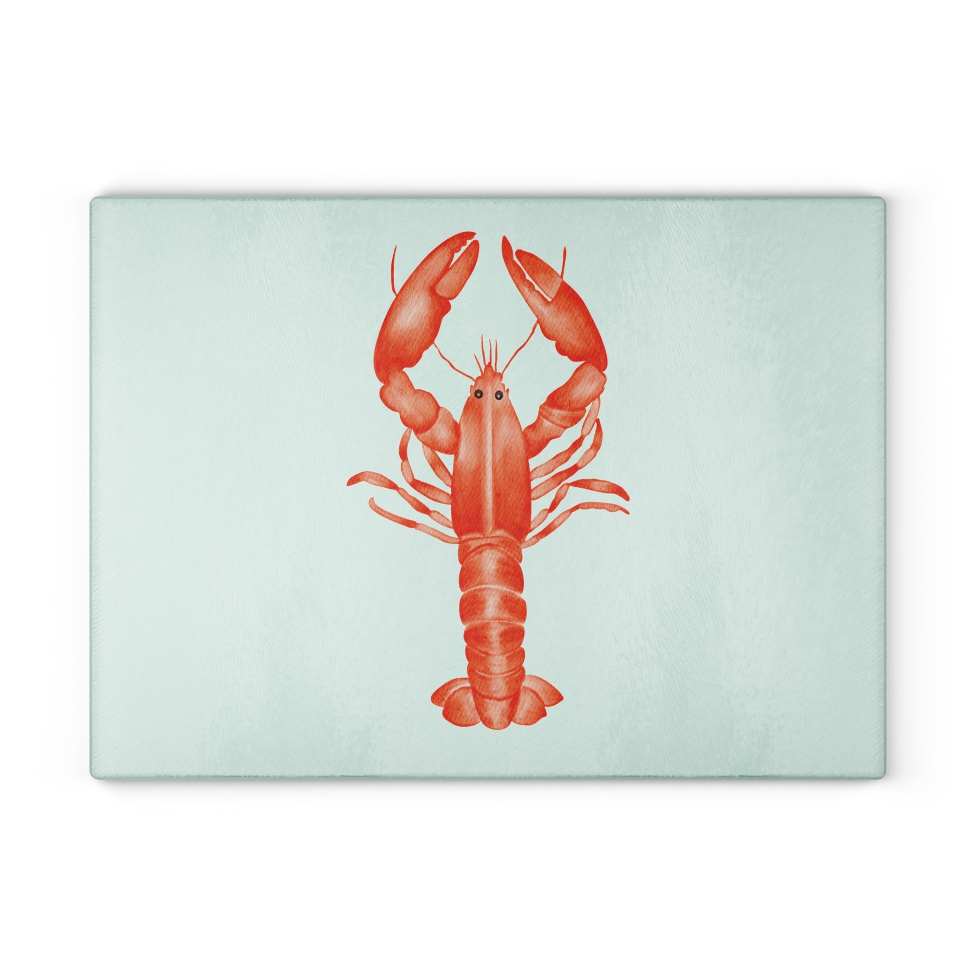 Coastal-style tempered glass cutting board with lobster artwork