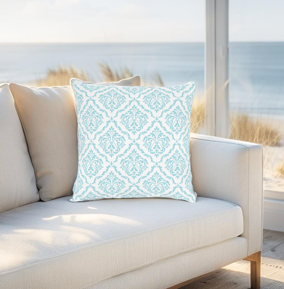Elegant light blue damask pillow perfect for coastal home decor.
