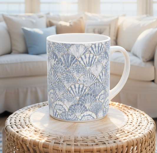 Coastal coffee mug with delicate seashell illustrations, ideal beach house gift