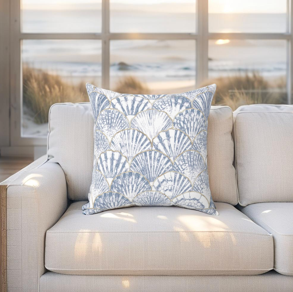 Nautical-style throw pillow with seashell design, adds a seaside touch to any coastal home setting.