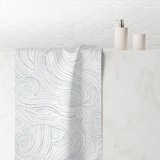 Coastal striped bath towel with ocean colors, perfect for adding a touch of the sea to your bathroom decor