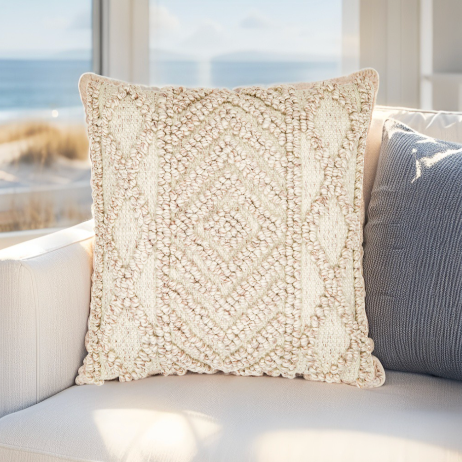 Coastal-inspired white pillow with woven design