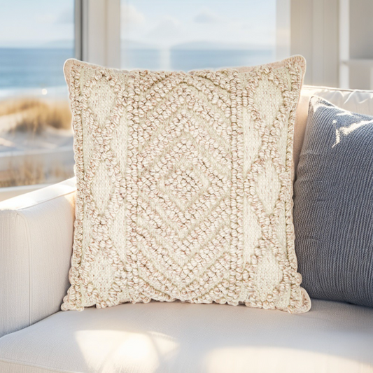 Coastal-inspired white pillow with woven design