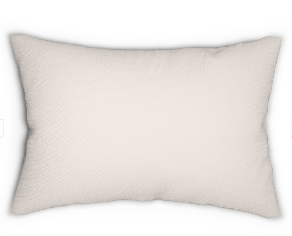 Coastal fall throw pillow with pumpkins and seashell design on white sofa