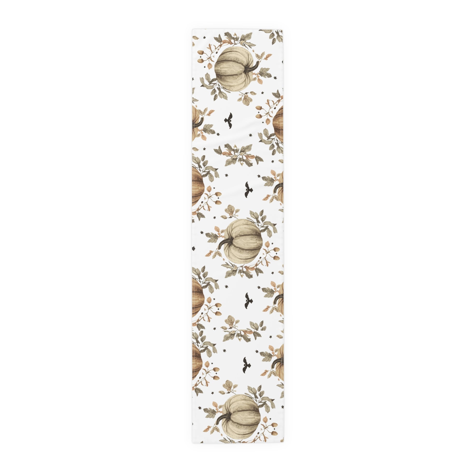 Table runner with pumpkin and leaf pattern on a white background