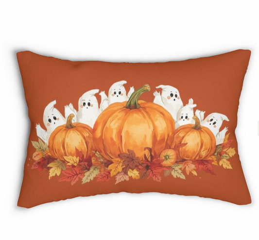 Decorative pillow with pumpkins and ghosts on a rust background