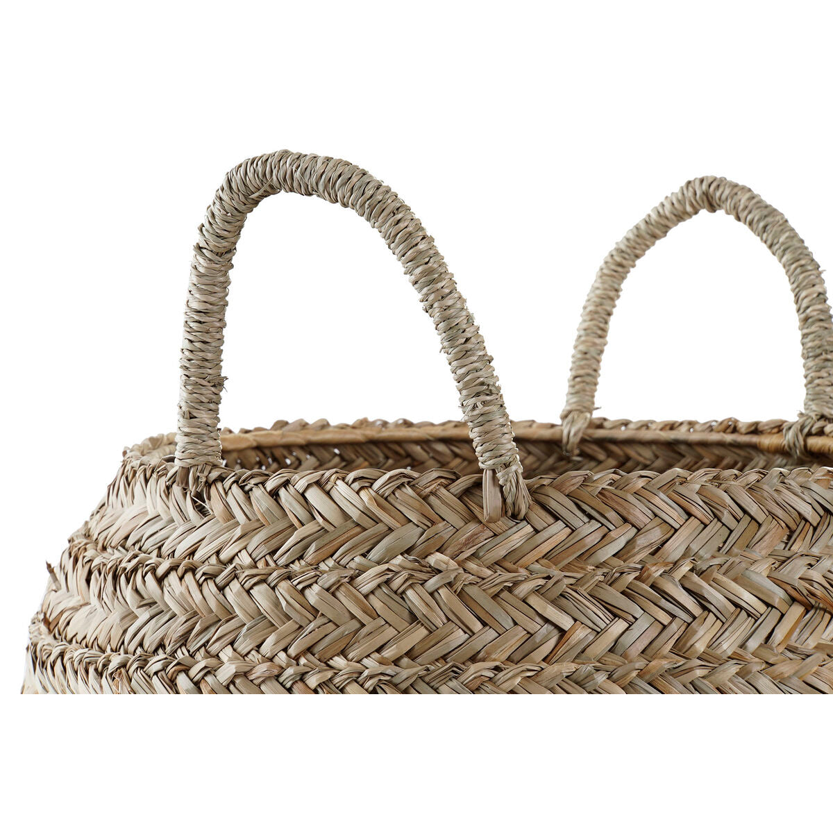 Natural rattan basket used for throw blankets and storage in a coastal home.