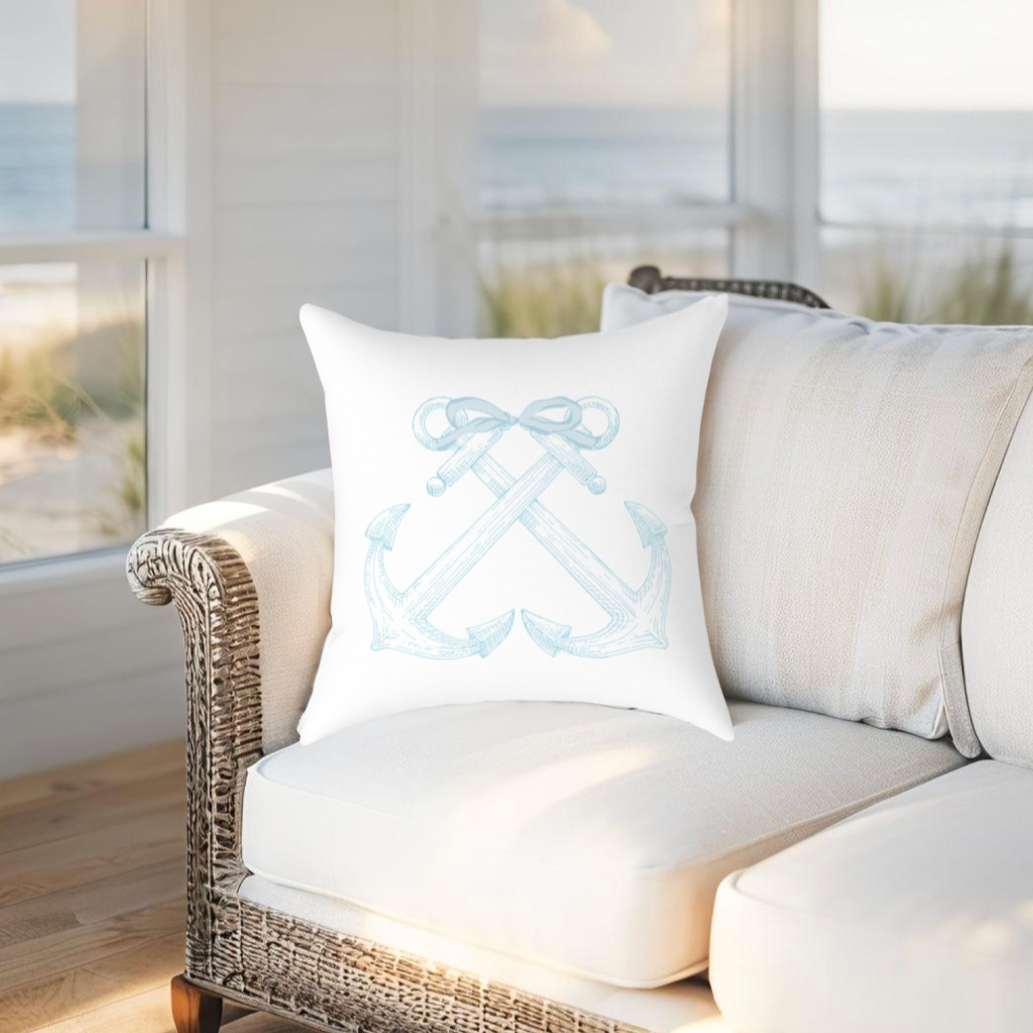 Light blue throw pillow with anchor motif, ideal for beach-themed, nautical or coastal-style interiors.