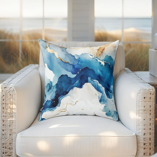 Abstract ocean wave pillow with blue marble effect, perfect for beach-inspired interiors.
