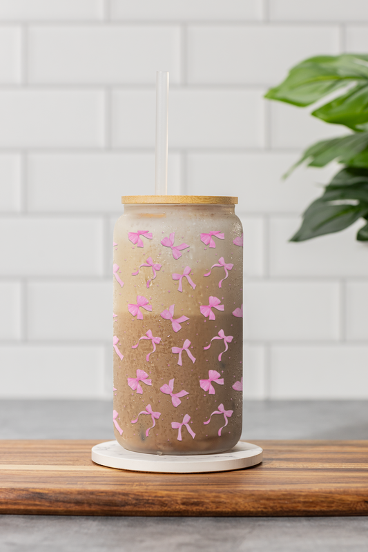Soft pink sipper glass with an elegant bow pattern, perfect for a feminine and chic aesthetic