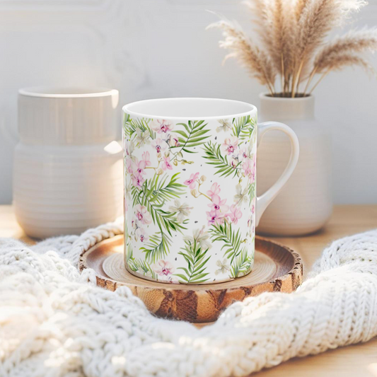 Tropical floral coffee mug with pink and green flowers for beach lovers.