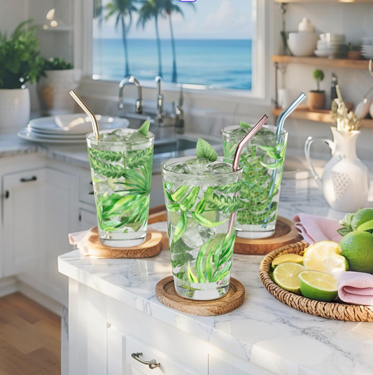Tropical palm print glass cup for summer drinks and beach-themed decor.