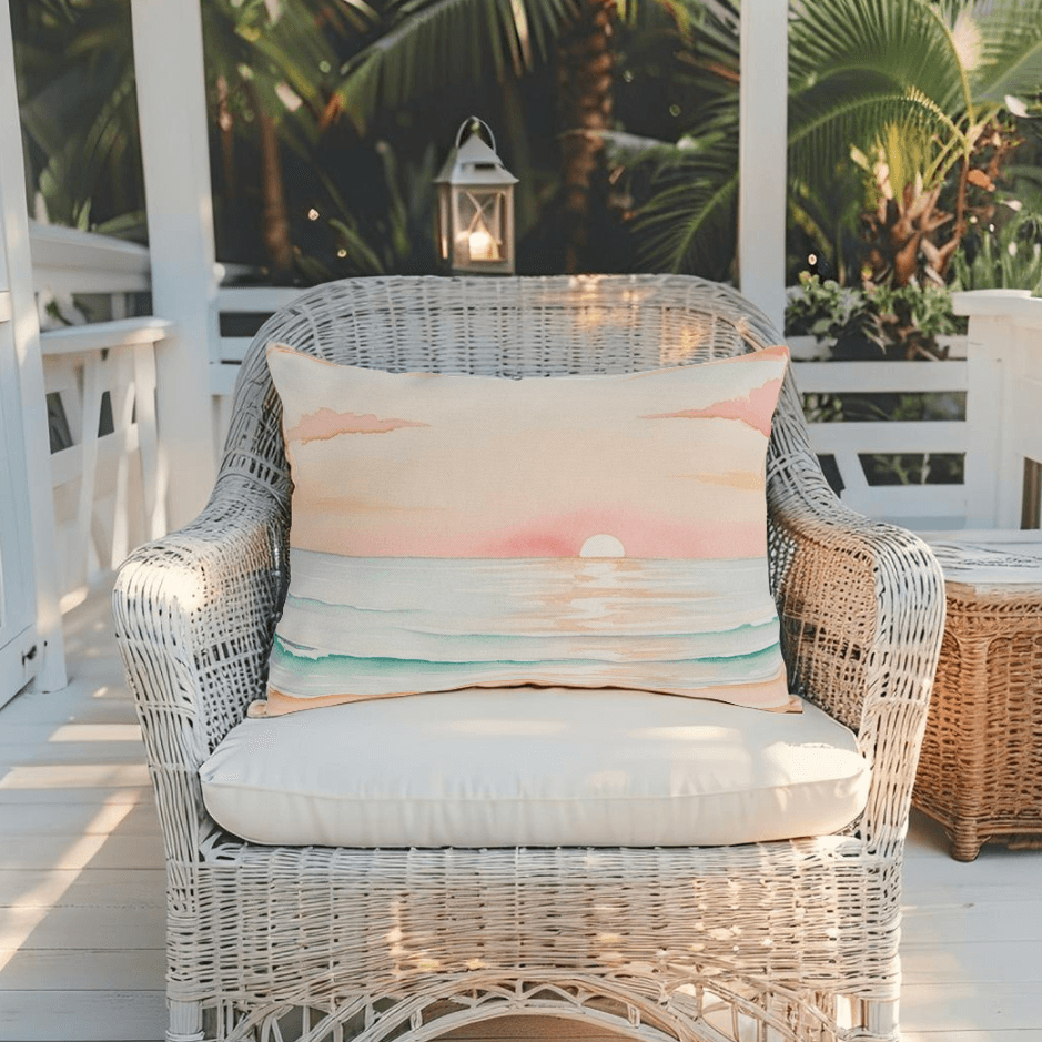 Weather-resistant throw pillow with a peaceful beach-themed sunset design